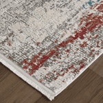 Elegant area rug with a modern abstract design in ivory, gray, and red accents. Perfect for adding style and comfort to any living space.