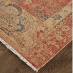 Style area rug with intricate floral and geometric patterns in light rust, beige, and blue tones. Perfect for adding warmth and character to any living space.