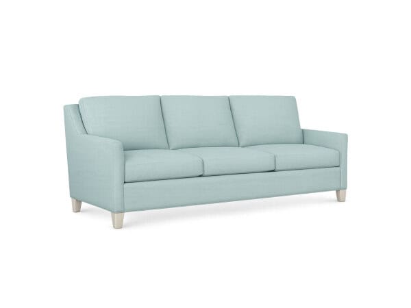 Light blue Jada Long Sofa with three cushions and wooden legs, perfect for modern living rooms.