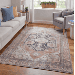 Elegant area rug from the Percy Collection featuring intricate patterns in brown and rust tones. Perfect for adding warmth and style to your living space.