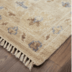 Elegant area rug featuring a classic floral pattern in blue, ivory, and soft pink tones, perfect for adding a touch of sophistication to any living space.