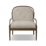 Plush beige upholstered armchair with wooden and metal frame, stylish and comfortable for modern living rooms.