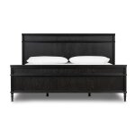 Black wooden bed frame with white pillows on a plain background.