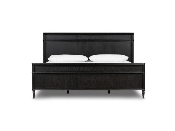 Black wooden bed frame with white pillows on a plain background.
