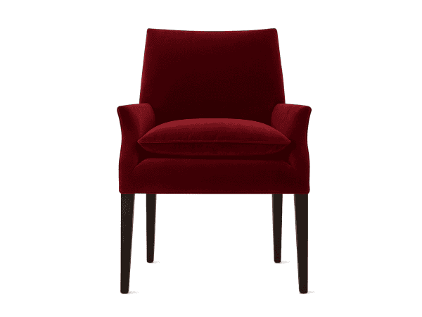 Luxurious red velvet armchair with dark wooden legs, stylish and comfortable furniture piece for modern living rooms or lounge areas. Perfect for adding a pop of color and elegance to any space.