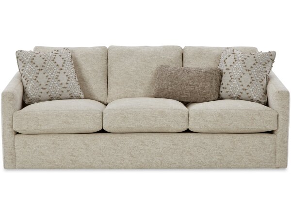 Plush beige upholstered sofa with decorative throw pillows, perfect for living rooms and family spaces.
