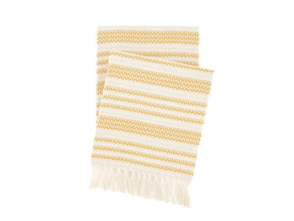 Soft yellow and cream woven striped throw blanket with fringe detail, perfect for cozying up or adding a splash of color to your living space.