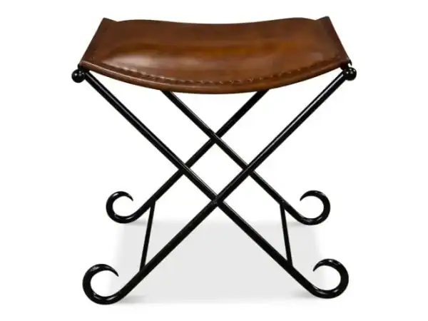 Vintage leather and wrought iron entryway bench with elegantly curved legs, perfect for rustic or modern decor accents.