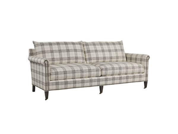 Plaid upholstered sofa with dark wooden legs and rolled arms, perfect for classic or vintage living room decor.