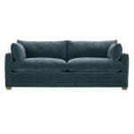 Elegant navy blue fabric sofa with plush cushions and rolled arms, perfect for living rooms or family spaces, available at Swann's Furniture & Design in Tyler, Texas.