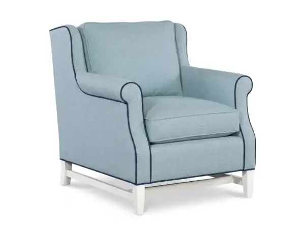 Light blue Louie Chair with wingback design, rolled arms, and white wooden legs, perfect for living rooms and reading nooks.