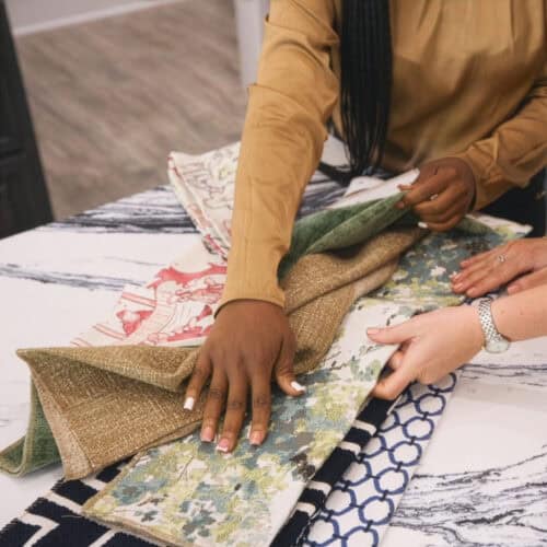 Interior Design Consultation At Swann'S Furniture &Amp; Design Showcasing Fabric And Upholstery Options In Tyler, Texas.
