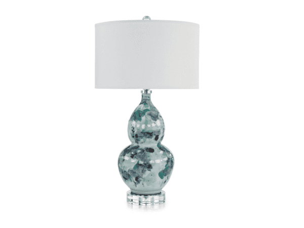 Elegant glass table lamp with a white fabric shade, perfect for adding a touch of sophistication to any room.