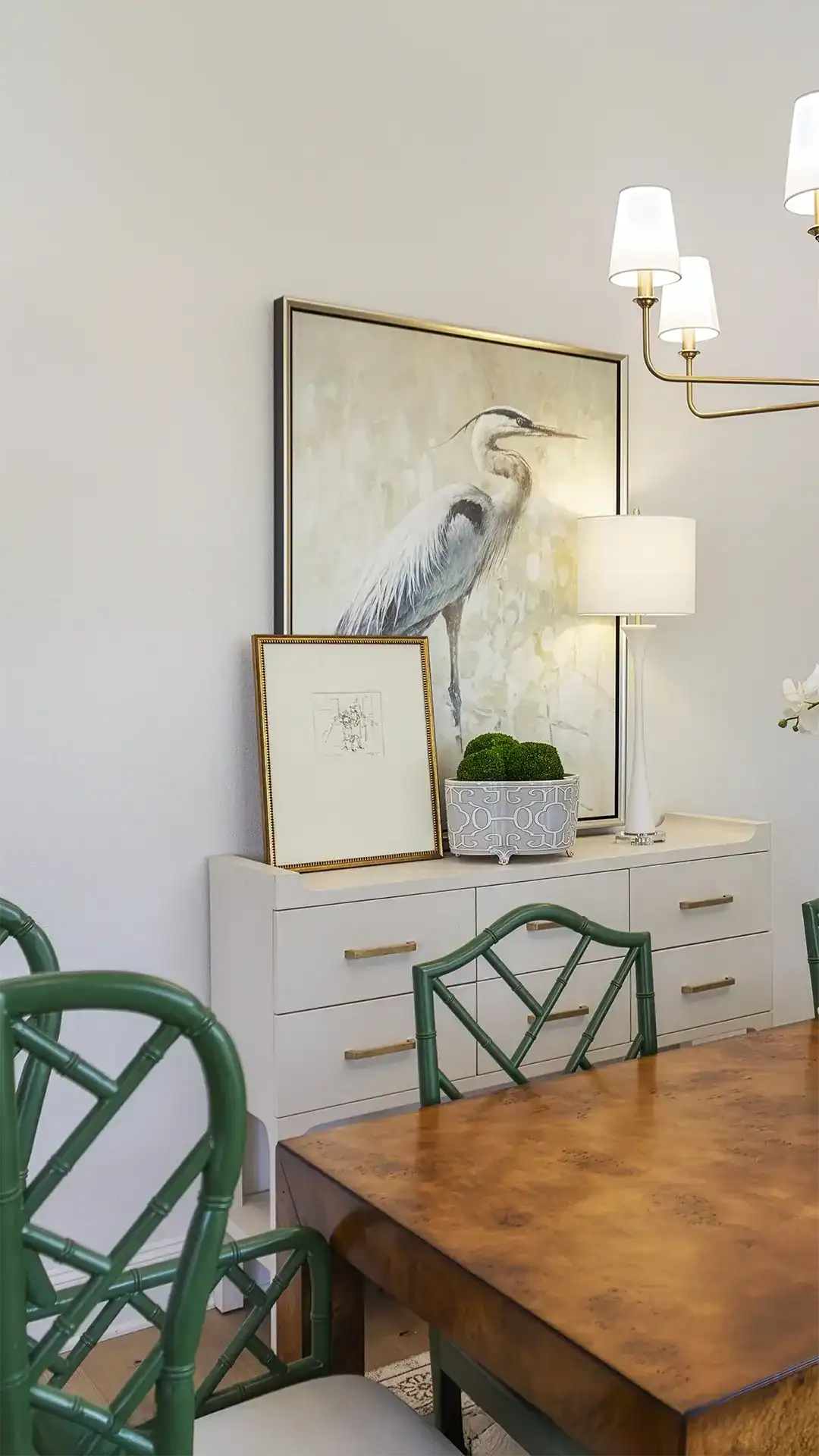 Beautiful Heron Painting Displayed On A White Wall In A Stylish Interior, Complemented By Modern Lighting And Decor, Showcasing Swann'S Furniture &Amp; Design In Tyler, Texas.