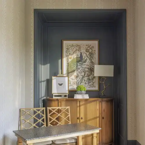 Stylish Entryway Featuring A Wooden Console Table, Decorative Artwork, And A Table Lamp In A Cozy, Well-Lit Corner Of Swann'S Furniture &Amp; Design In Tyler, Texas.