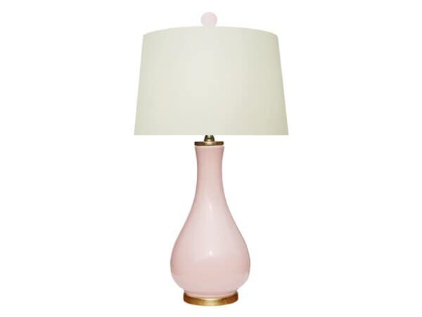 Pink Ceramic Table Lamp With A White Fabric Shade, Perfect For Living Rooms Or Bedrooms, Adding A Soft Touch Of Color And Ambient Lighting To Your Space.
