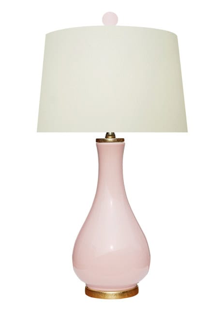 Elegant Pink Ceramic Table Lamp With White Shade Pink Ceramic Table Lamp With A White Fabric Shade, Perfect For Living Rooms Or Bedrooms, Adding A Soft Touch Of Color And Ambient Lighting To Your Space.