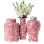Pink floral ceramic vases with white flowers, decorative home accents.