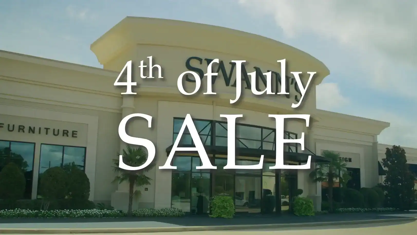 Exterior View Of Swann&Amp;Apos;S Furniture Store In Tyler, Texas, Advertising The 4Th Of July Sale With Large Signage On The Building.