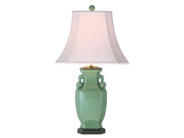 Green Ceramic Vase Lamp With A White Fabric Shade, Decorative Handles, And A Black Base, Ideal For Classic Or Modern Interior Decor.